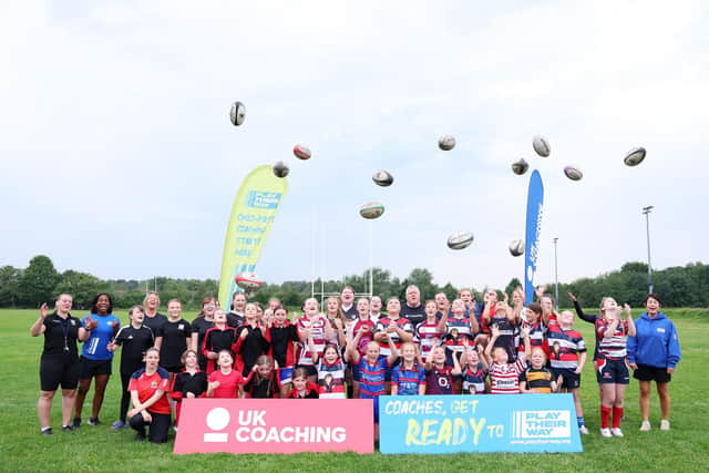 Maggie Alphonsi and the girls took part in a group photo at the end of a child-first coaching session put on by Broughton Park.