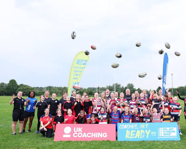 Maggie Alphonsi and the girls took part in a group photo at the end of a child-first coaching session put on by Broughton Park.