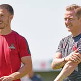 Doncaster Rovers boss Gary McSheffrey with midfielder Tommy Rowe. Photo: Andrew Roe/AHPIX LTD.