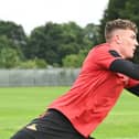 Goalkeeper Louis Jones does some handling work this week in pre-season training