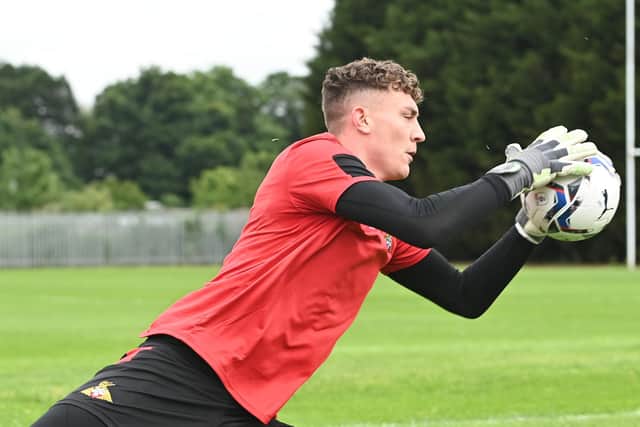 Goalkeeper Louis Jones does some handling work this week in pre-season training