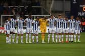 Hartlepool United's players observe a minute's silence as a mark of respect at Victoria Park earlier this season (photo: Mark Fletcher | MI News).