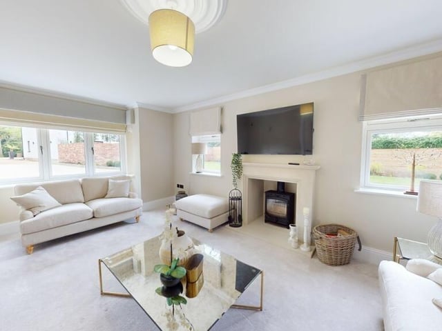 The lounge, with feature fireplace and stove.