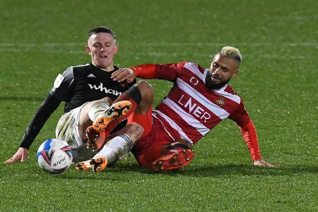 John Bostock goes to ground with Accrington's Colby Bishop. Picture: Andrew Roe/AHPIX