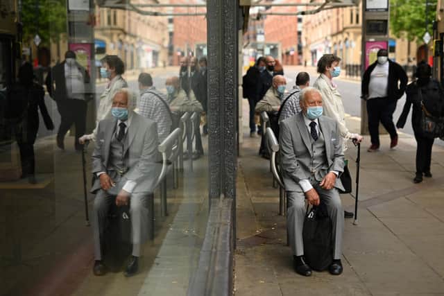 Shopper wear face masks in the city centre of Sheffield (Photo by Oli SCARFF / AFP) (Photo by OLI SCARFF/AFP via Getty Images)