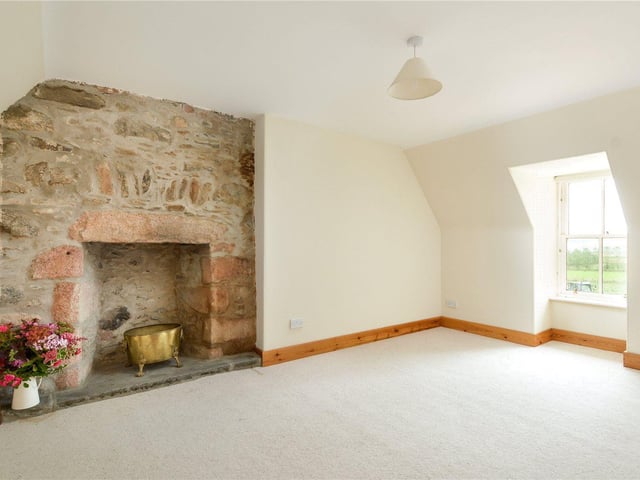 Although the house has been restored, care was taken to maintain original features such as fireplaces.
