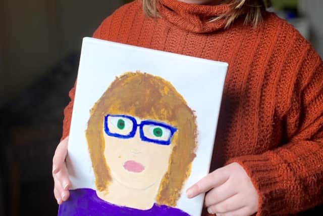 Emily Head, who attends the Artistic Spectrum group, showcases her self-portrait.
