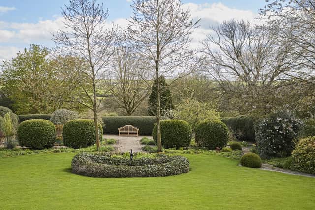 South facing mature gardens have views of glorious open countryside beyond.