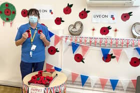 Sue Wilkinson with the poppies on sale at the hospital.