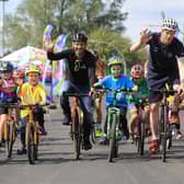 Ed Clancy, right, with Graham Briggs and youngsters at the Doncaster cycle track.