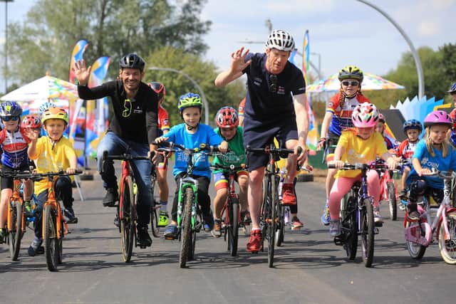 Ed Clancy, right, with Graham Briggs and youngsters at the Doncaster cycle track.