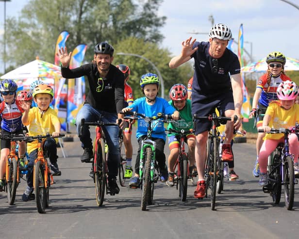 Ed Clancy, right, with Graham Briggs and youngsters at the Doncaster cycle track.