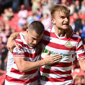 Doncaster's George Miller celebrates his equaliser against Sutton United with Tommy Rowe, who grabbed the assist.