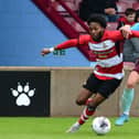 Doncaster Rovers' Deji Sontona dribbles with the ball.