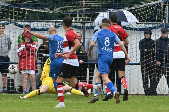 Rossington Main's Ross Hannah opens the scoring during their pre-season friendly against Doncaster Rovers last month.