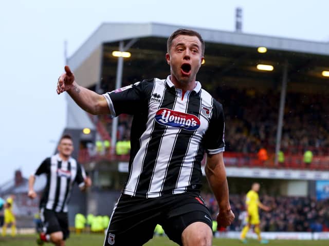 Ross Hannah celebrates scoring a goal during his Grimsby Town days (photo by Matthew Lewis/Getty Images).