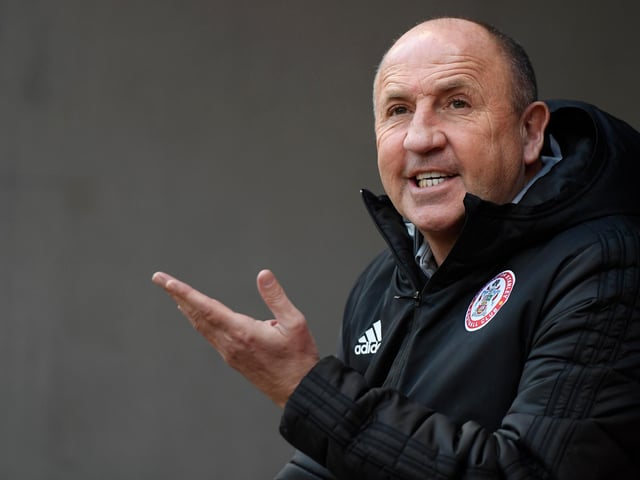 Career win percentage: 41.4%. Number of games at current club: 303.