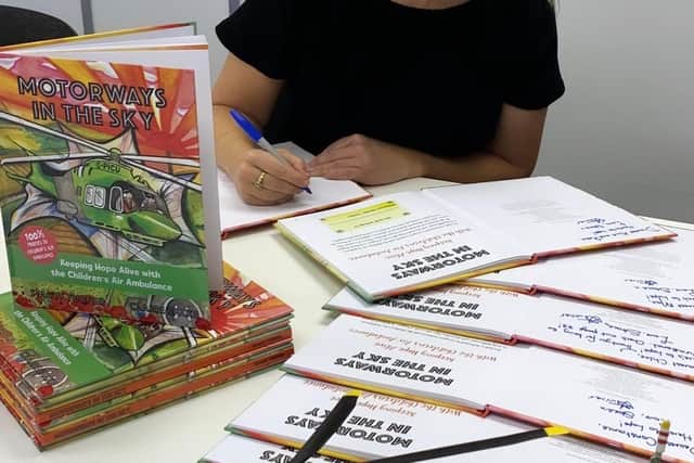 Stacey Turner signing copies of Motorways in the Sky.