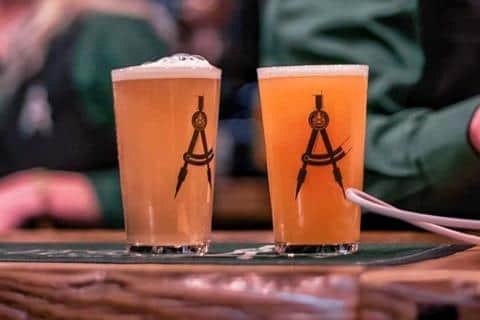 Draughtsman glasses filled with beer.