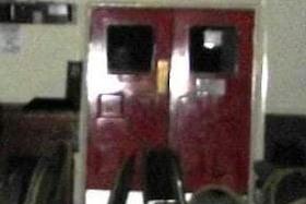 Photo of a spirit on the left looking through the double doors. There were five people in the building that night and all were stood in the same room next to each other, so who was the sixth? Picture taken by Andrea Lee Law