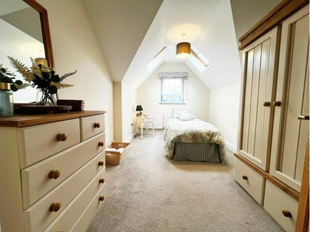 Another of the five individually styled bedrooms.