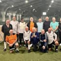 The Doncaster Dynamos walking football team. David is pictured holding a trophy with Frank far left.