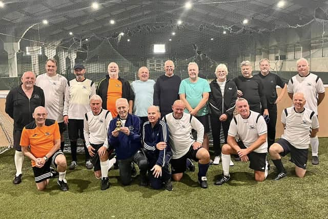 The Doncaster Dynamos walking football team. David is pictured holding a trophy with Frank far left.