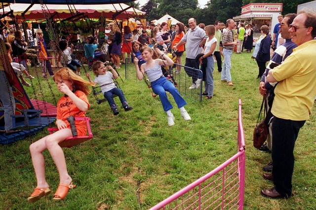 Visitors enjoying the rides at Cusworth Carnival... 13 June 1999