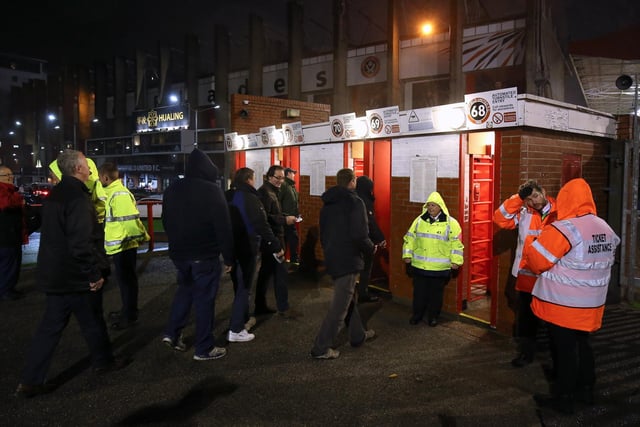 Supporters make their way through the turnstiles at Bramall Lane, Sheffield