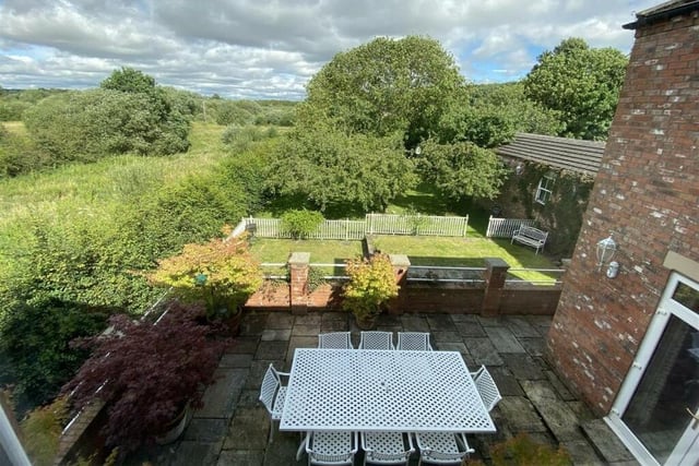 Outdoor facilities include private lawned gardens and a large patio.