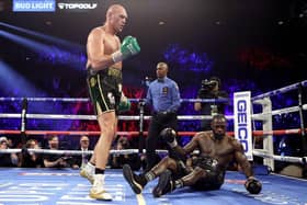 Tyson Fury knocks down Deontay Wilder in the fifth round during their heavweigh title bout. (Photo by Al Bello/Getty Images)