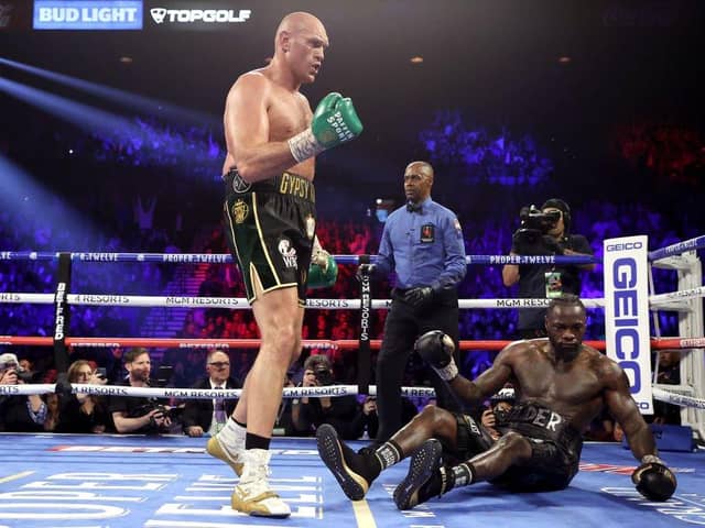 Tyson Fury knocks down Deontay Wilder in the fifth round during their heavweigh title bout. (Photo by Al Bello/Getty Images)
