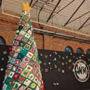 The tree is 10 foot tall and is made up of 300 squares.
