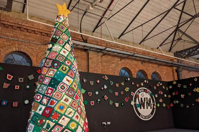 The tree is 10 foot tall and is made up of 300 squares.