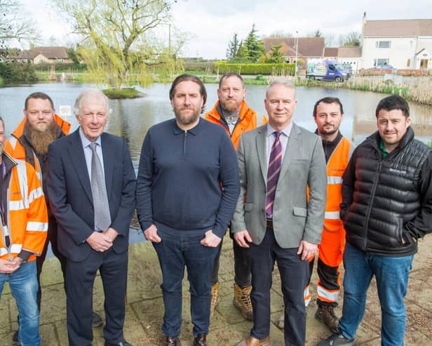 Councillors and members of the Quickline fibre team at Westwoodside Pond.