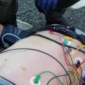 Arthur receiving life saving treatment at the roadside.