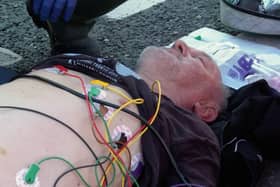 Arthur receiving life saving treatment at the roadside.