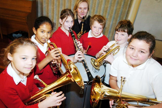 Year five Pupils at Bentley High street primary school are one of six schools in Doncaster which took part in a new government initiative to learn a musical instrument back in 2007. Pictured with their instruments are l-r Roschelle Vose, nine, Tenor Horn, Tori Williams, nine, Cornet, Bethany Hall, nine, Clarinet, School music co-ordinator Elizabeth Barton, who teaches Saxophone and Clarinet, Taylor Cassady, ten, Bass drum, Josh Mair, ten, Cornet, and Yasmin Lanouar, nine, Baratone.