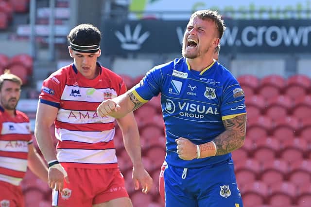 Connor Robinson celebrates his try against Oldham. Picture: Howard Roe/AHPIX.com