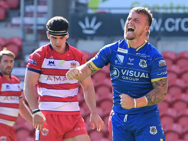 Connor Robinson celebrates his try against Oldham. Picture: Howard Roe/AHPIX.com