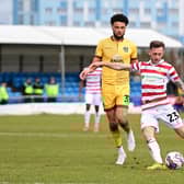 Charlie Lakin has a shot at goal.