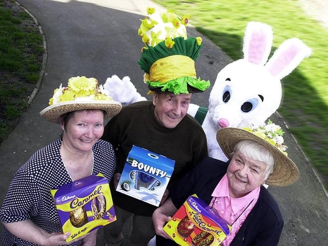 Easter bonnet winner June Hepworth (left), second-placed Kenneth Robinson, and third-placed Betty McDonnell, are pictured with their Carcroft Asda prizes. Warren the bunny, alias 16 year-old Claire Birkinshaw, was on hand to add to the Easter flavour of the event, held at the Chestnut View Communal Hall, Edward Road, Carcroft, in 2002