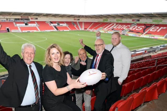 Ray Green, Doncaster Rugby League Club, Lorna Reeve, Visit Doncaster, Marie Hepburn, Club Doncaster, Stewart Piper, Doncaster Rugby League Club president, Chris Dungworth, Business Doncaster and Ben Lewis, Club Doncaster, pictured celebrating after the borough was chosen as a host venue at the Keepmoat Stadium. Picture: Marie Caley/Doncaster Free Press