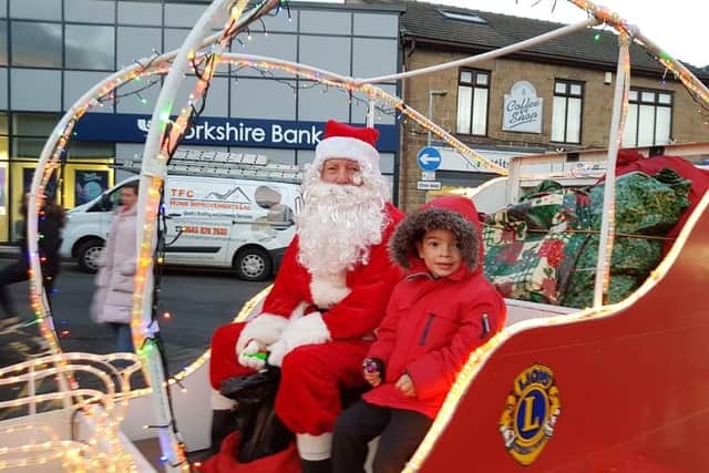 Santa arriving with his helper AJ Chapman at the last switch on in 2019