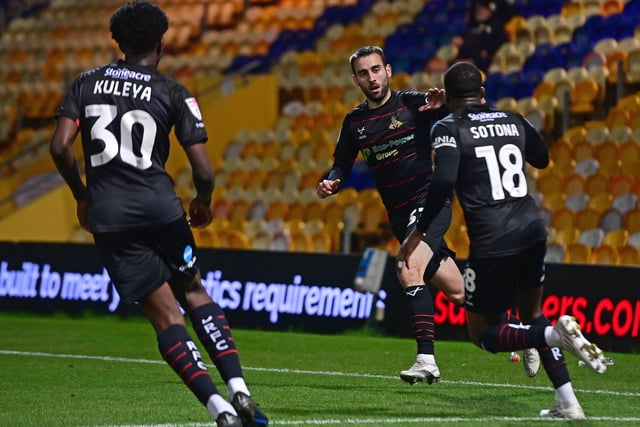 Doncaster Rovers' Ben Close celebrates his goal with Tavonga Kuleya and Deji Sotona.