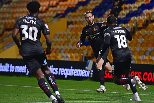Doncaster Rovers' Ben Close celebrates his goal with Tavonga Kuleya and Deji Sotona.