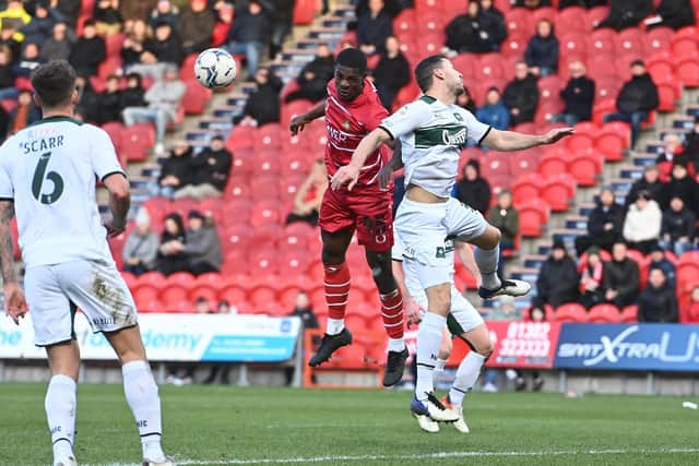 New signing Mipo Odubeko goes up for a header. Picture: Howard Roe/AHPIX