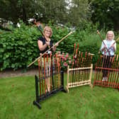 Lindsey (right) with colleague Tracey Gaughan and just some of the walking sticks that Rod has donated