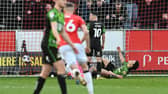 Doncaster's players react to the third goal.