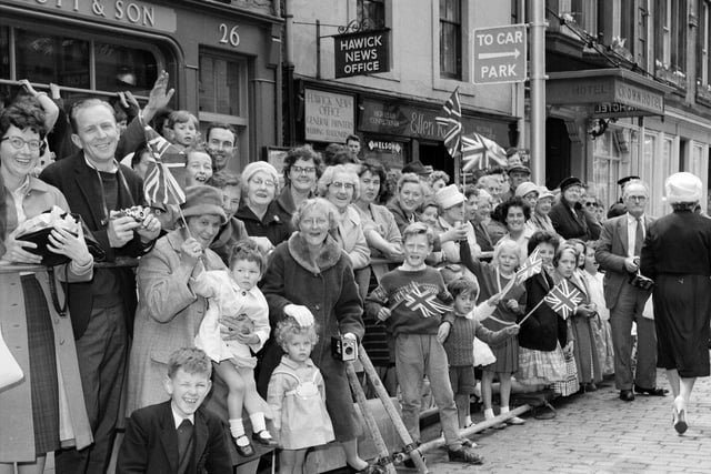 Crowds waiting to greet the Queen and the Duke of Edinburgh on their visit to Hawick in July 1962.